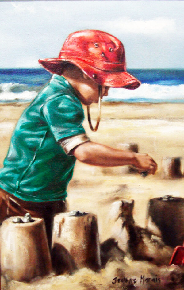 Sand Castles - Giclée print of a child wearing a red hat and green shirt building sandcastles on a sunny beach. Ocean waves roll gently in the background