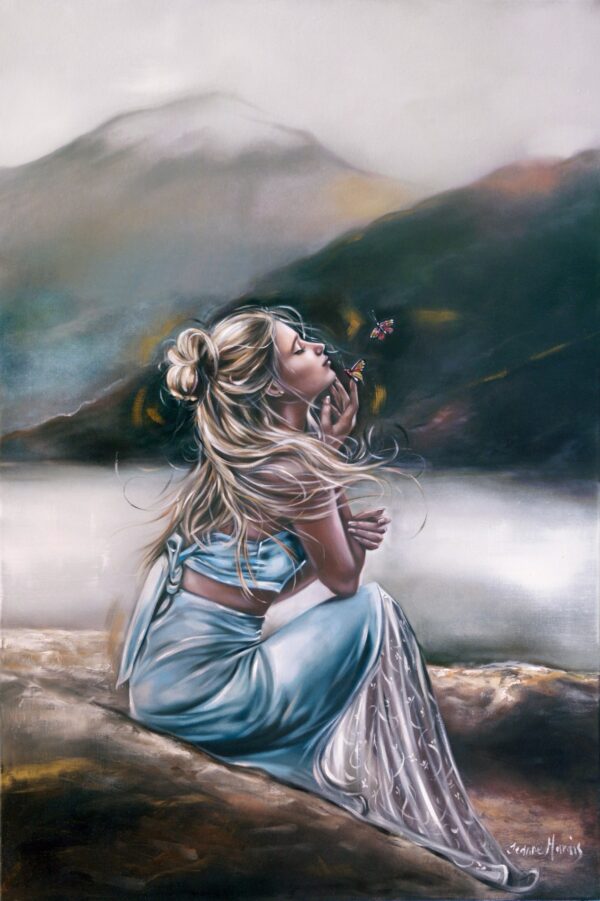 Lonesome Fantasy - Giclée print of oil painting of a woman in a flowing blue dress sitting on a rock by a serene lake, holding a butterfly near her face. Mountains rise in the misty background, evoking tranquility